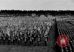 Image of German troops marching on a rough field Germany, 1933, second 25 stock footage video 65675071553