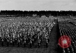 Image of German troops marching on a rough field Germany, 1933, second 26 stock footage video 65675071553