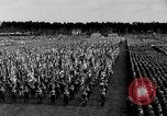 Image of German troops marching on a rough field Germany, 1933, second 27 stock footage video 65675071553