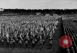 Image of German troops marching on a rough field Germany, 1933, second 28 stock footage video 65675071553