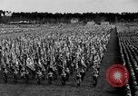 Image of German troops marching on a rough field Germany, 1933, second 29 stock footage video 65675071553