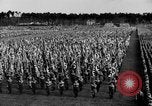 Image of German troops marching on a rough field Germany, 1933, second 30 stock footage video 65675071553