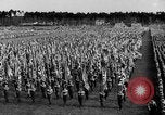 Image of German troops marching on a rough field Germany, 1933, second 31 stock footage video 65675071553