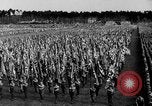 Image of German troops marching on a rough field Germany, 1933, second 32 stock footage video 65675071553