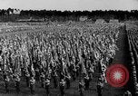Image of German troops marching on a rough field Germany, 1933, second 33 stock footage video 65675071553
