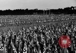 Image of German troops marching on a rough field Germany, 1933, second 34 stock footage video 65675071553