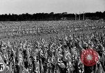 Image of German troops marching on a rough field Germany, 1933, second 35 stock footage video 65675071553
