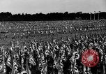 Image of German troops marching on a rough field Germany, 1933, second 36 stock footage video 65675071553
