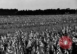 Image of German troops marching on a rough field Germany, 1933, second 37 stock footage video 65675071553