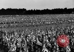Image of German troops marching on a rough field Germany, 1933, second 38 stock footage video 65675071553