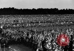 Image of German troops marching on a rough field Germany, 1933, second 41 stock footage video 65675071553