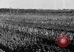 Image of German troops marching on a rough field Germany, 1933, second 50 stock footage video 65675071553