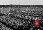 Image of German troops marching on a rough field Germany, 1933, second 51 stock footage video 65675071553