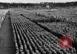Image of German troops marching on a rough field Germany, 1933, second 55 stock footage video 65675071553