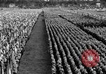 Image of German troops marching on a rough field Germany, 1933, second 57 stock footage video 65675071553