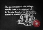 Image of Steam driven hammer forges hot steel billets into Studebaker engine parts South Bend Indiana USA, 1920, second 4 stock footage video 65675071728