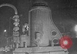 Image of Steam driven hammer forges hot steel billets into Studebaker engine parts South Bend Indiana USA, 1920, second 15 stock footage video 65675071728