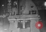 Image of Steam driven hammer forges hot steel billets into Studebaker engine parts South Bend Indiana USA, 1920, second 20 stock footage video 65675071728