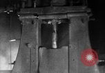 Image of Steam driven hammer forges hot steel billets into Studebaker engine parts South Bend Indiana USA, 1920, second 25 stock footage video 65675071728