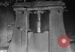 Image of Steam driven hammer forges hot steel billets into Studebaker engine parts South Bend Indiana USA, 1920, second 26 stock footage video 65675071728