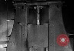 Image of Steam driven hammer forges hot steel billets into Studebaker engine parts South Bend Indiana USA, 1920, second 30 stock footage video 65675071728