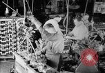 Image of Assembling engines in an Studebaker automobile plant South Bend Indiana USA, 1920, second 26 stock footage video 65675071729