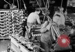 Image of Assembling engines in an Studebaker automobile plant South Bend Indiana USA, 1920, second 28 stock footage video 65675071729