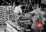 Image of Assembling engines in an Studebaker automobile plant South Bend Indiana USA, 1920, second 29 stock footage video 65675071729