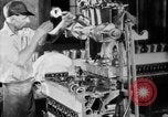 Image of Assembling engines in an Studebaker automobile plant South Bend Indiana USA, 1920, second 30 stock footage video 65675071729