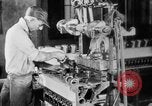 Image of Assembling engines in an Studebaker automobile plant South Bend Indiana USA, 1920, second 31 stock footage video 65675071729