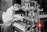 Image of Assembling engines in an Studebaker automobile plant South Bend Indiana USA, 1920, second 32 stock footage video 65675071729