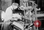 Image of Assembling engines in an Studebaker automobile plant South Bend Indiana USA, 1920, second 33 stock footage video 65675071729