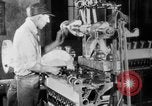 Image of Assembling engines in an Studebaker automobile plant South Bend Indiana USA, 1920, second 34 stock footage video 65675071729