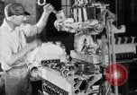 Image of Assembling engines in an Studebaker automobile plant South Bend Indiana USA, 1920, second 35 stock footage video 65675071729