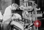 Image of Assembling engines in an Studebaker automobile plant South Bend Indiana USA, 1920, second 37 stock footage video 65675071729