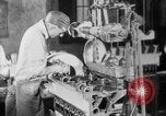 Image of Assembling engines in an Studebaker automobile plant South Bend Indiana USA, 1920, second 38 stock footage video 65675071729