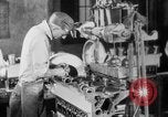 Image of Assembling engines in an Studebaker automobile plant South Bend Indiana USA, 1920, second 39 stock footage video 65675071729
