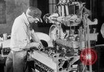 Image of Assembling engines in an Studebaker automobile plant South Bend Indiana USA, 1920, second 40 stock footage video 65675071729