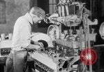 Image of Assembling engines in an Studebaker automobile plant South Bend Indiana USA, 1920, second 41 stock footage video 65675071729