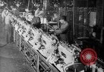 Image of Assembling engines in an Studebaker automobile plant South Bend Indiana USA, 1920, second 62 stock footage video 65675071729