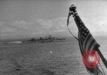 Image of Silhouettes of U.S. Army soldiers boarding a troop transport ship. Pacific Theater, 1942, second 3 stock footage video 65675071824