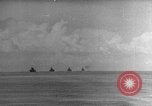 Image of Silhouettes of U.S. Army soldiers boarding a troop transport ship. Pacific Theater, 1942, second 4 stock footage video 65675071824