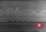 Image of Silhouettes of U.S. Army soldiers boarding a troop transport ship. Pacific Theater, 1942, second 5 stock footage video 65675071824
