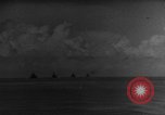 Image of Silhouettes of U.S. Army soldiers boarding a troop transport ship. Pacific Theater, 1942, second 6 stock footage video 65675071824