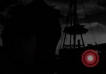 Image of Silhouettes of U.S. Army soldiers boarding a troop transport ship. Pacific Theater, 1942, second 20 stock footage video 65675071824