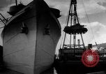 Image of Silhouettes of U.S. Army soldiers boarding a troop transport ship. Pacific Theater, 1942, second 22 stock footage video 65675071824