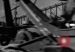 Image of Silhouettes of U.S. Army soldiers boarding a troop transport ship. Pacific Theater, 1942, second 24 stock footage video 65675071824