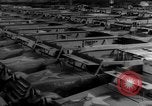 Image of Silhouettes of U.S. Army soldiers boarding a troop transport ship. Pacific Theater, 1942, second 26 stock footage video 65675071824