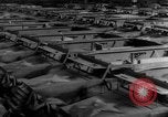 Image of Silhouettes of U.S. Army soldiers boarding a troop transport ship. Pacific Theater, 1942, second 27 stock footage video 65675071824