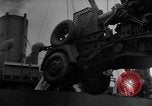 Image of Silhouettes of U.S. Army soldiers boarding a troop transport ship. Pacific Theater, 1942, second 30 stock footage video 65675071824